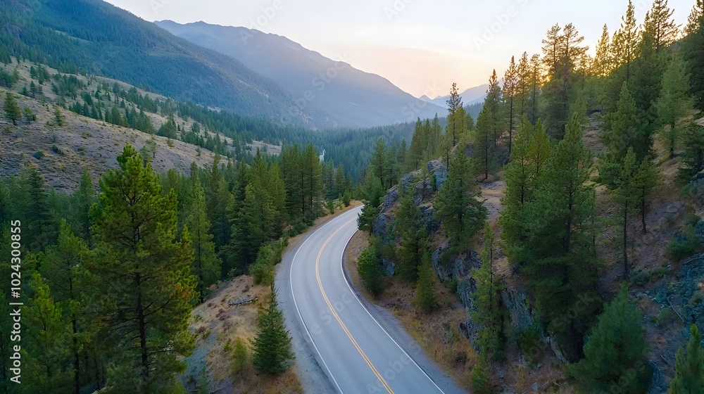 Scenic winding mountain road cutting through a lush verdant forest at the golden hour of sunrise offering a breathtaking vista of the surrounding landscape Scenic winding mountain road cutting through a lush verdant forest at the golden hour of sunrise offering a breathtaking vista of the surrounding landscape