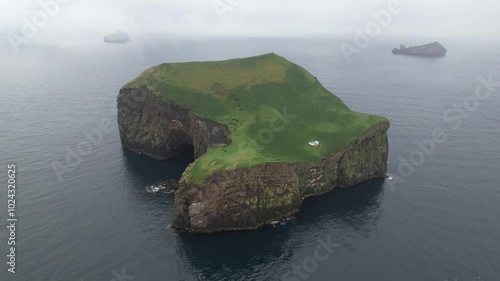 Aerial Footage of an isolated and deserted island in Iceland with a house/cottage. Filmed with a Drone. Different shots available in my portfolio.
