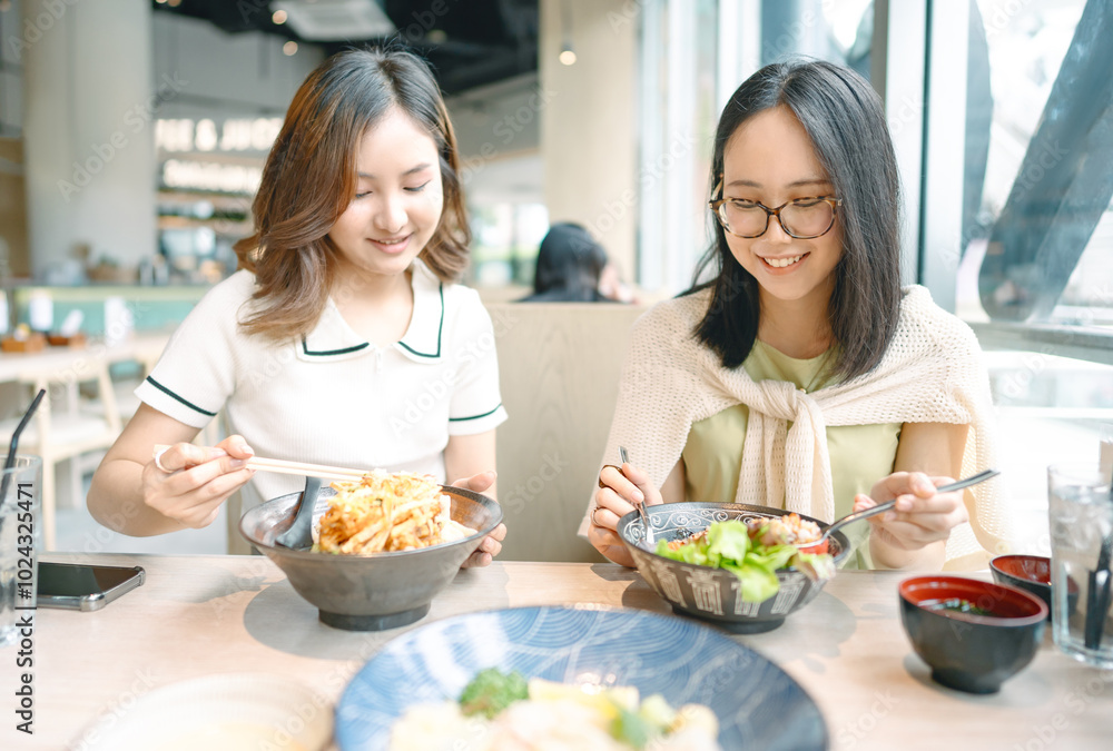 Happy two asian woman eating food at Japanese restaurant asia tasty from traditional culture together Happy two asian woman eating food at Japanese restaurant asia tasty from traditional culture together