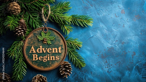 Rustic Advent begins sign with pine cones and greenery on blue background
