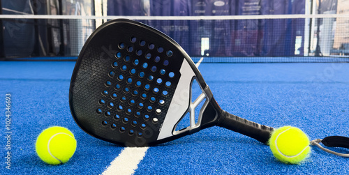 Fototapet Paddle racket with a ball ready to play the fastest growing sport in recent years worldwide