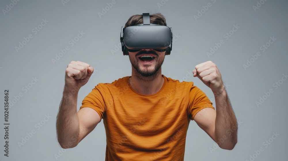 Immersed in the Game: Caucasian Man Enjoying Virtual Reality Experience on Gray Background Immersed in the Game: Caucasian Man Enjoying Virtual Reality Experience on Gray Background