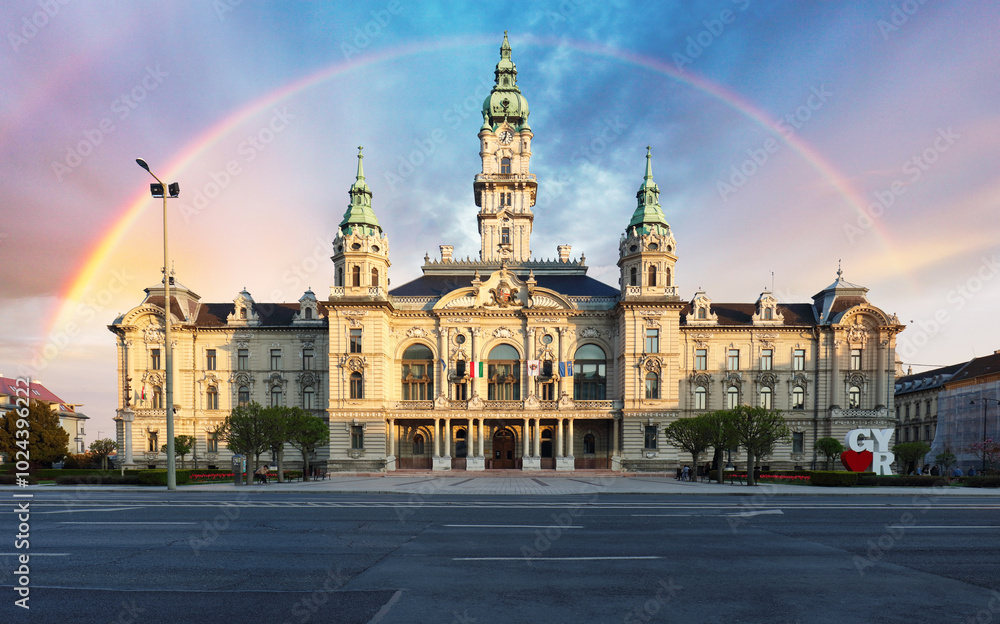 Fototapeta premium Rainbow over City hall in town Gyor, Hungary