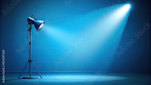 Blue spotlight background with studio lamp