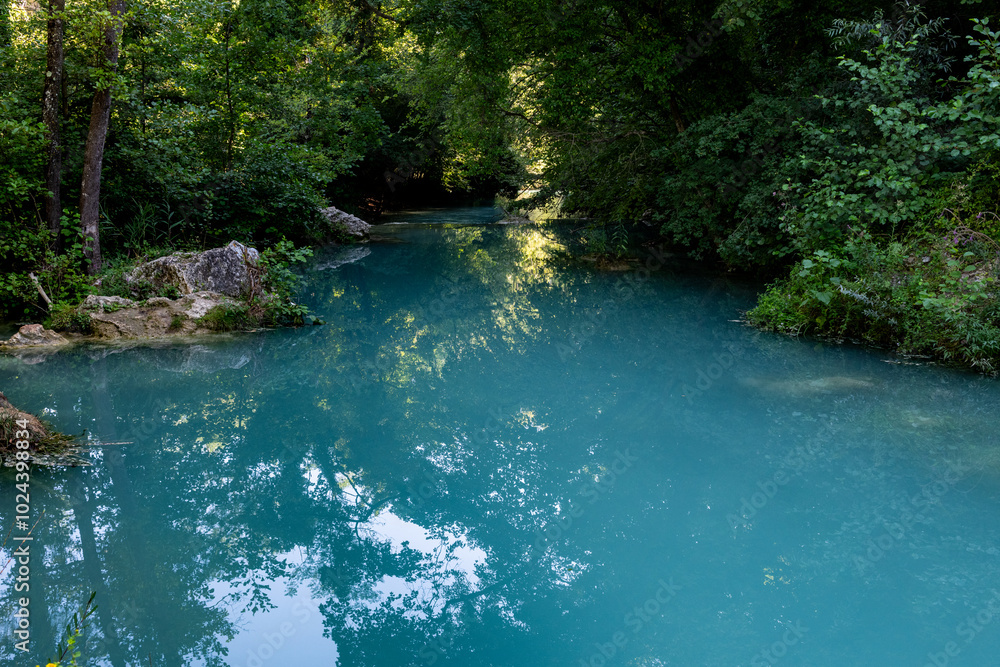 The milky waters of the Elsa River along the Diboratto Waterfall trail in Tuscany, central Italy, a popular destination for swimming and hiking. The milky waters of the Elsa River along the Diboratto Waterfall trail in Tuscany, central Italy, a popular destination for swimming and hiking.