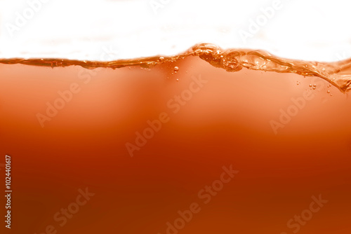 Orange water or juice and splash waves for nature