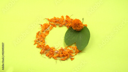 Indian Festival Dussehra, showing golden leaf and flowers with Kumkum and rice on White background. Greeting card. photo