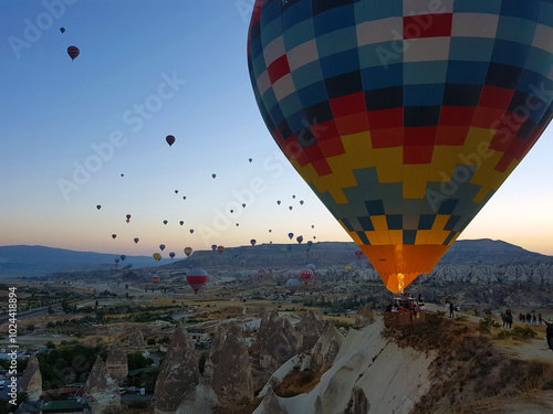 Balloons rising at sunrise and Cappadocia