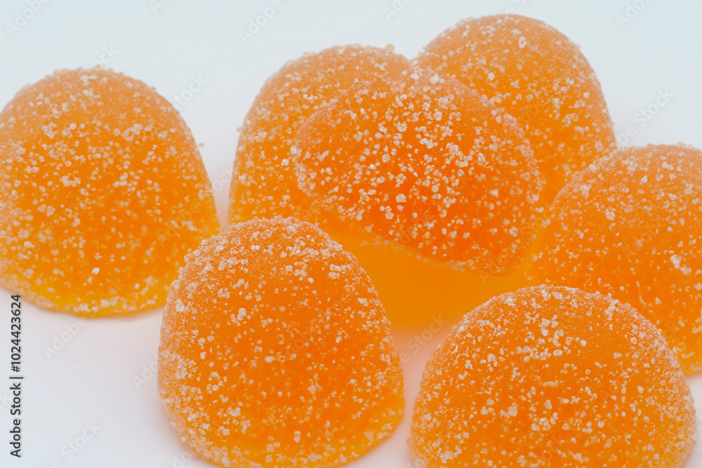 Marmalade in orange on gray . sweet dessert food concept. a round gummy on a gray with oranges and oranges. a round gummy on a white with marmalade and lifestyle oranges. Marmalade in orange on gray . sweet dessert food concept. a round gummy on a gray with oranges and oranges. a round gummy on a white with marmalade and lifestyle oranges.