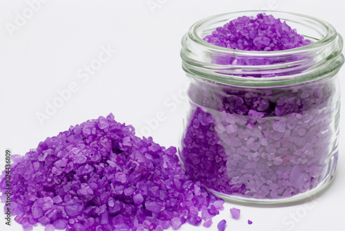 Jar of and purple sea salts spilled onto white. natural graphic concept. a jar of white and purple sea salts spilled onto a white. a jar of white and purple sea salts spilled from a scuba diver.