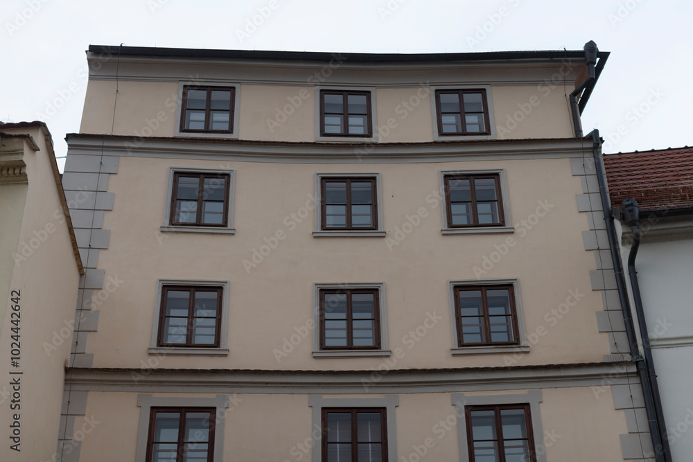 A very large structure that features numerous windows all across its facade, making it appear bright and spacious from the outside A very large structure that features numerous windows all across its facade, making it appear bright and spacious from the outside