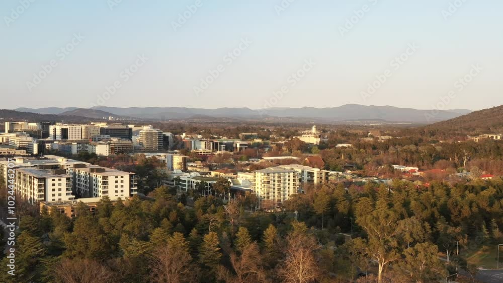 Northbound avenue with modern tram line in Canberra city capital federal territory in Australia.
Northbound avenue with modern tram line in Canberra city capital federal territory in Australia.
