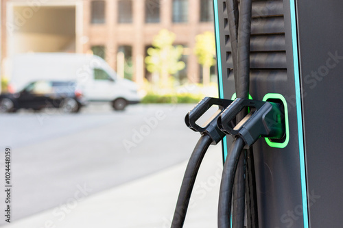 Charge Point with Charging Handle Close up of Modern Fast ev Charging Station. Charging Hardware. Most Efficient 400 kW Charger.