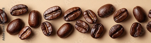 Freshly roasted coffee beans arranged beautifully on a smooth surface, showcasing their rich texture and earthy tones.