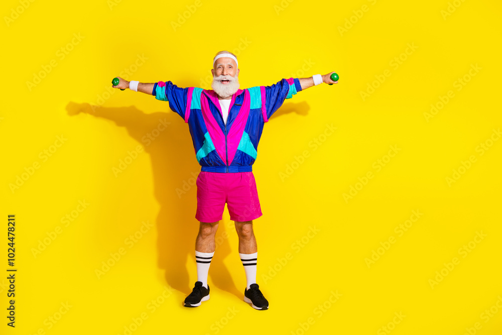 Full size photo poster of granddad sportsman lift dumbbells spread hands wear trendy vintage sportswear isolated on yellow color background Full size photo poster of granddad sportsman lift dumbbells spread hands wear trendy vintage sportswear isolated on yellow color background