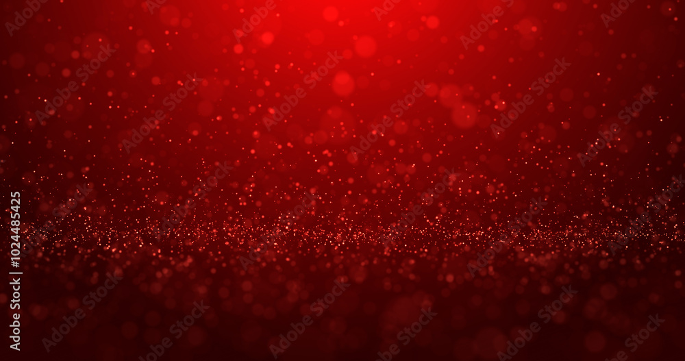 Abstract red background of bright glowing glitter particles and beautiful bokeh.