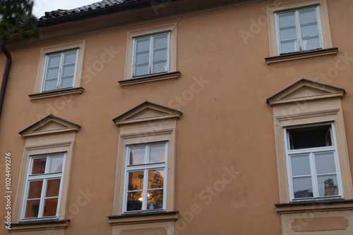 This is a structure that features numerous windows scattered throughout its design, creating a unique architectural appearance