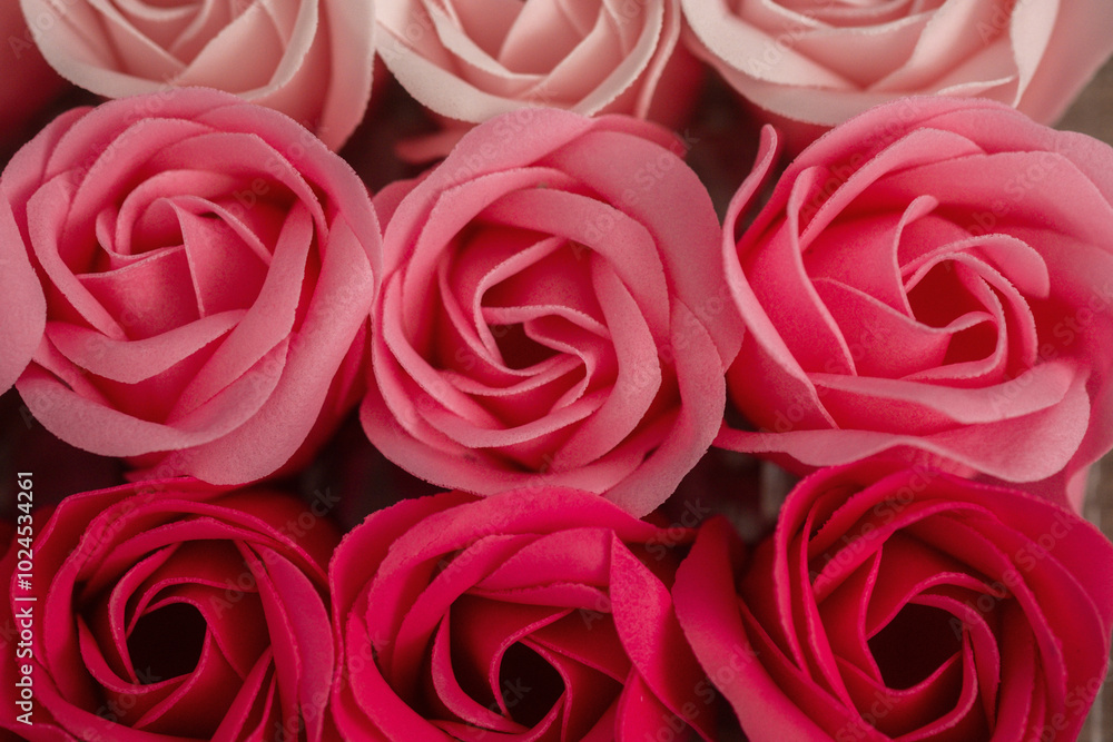 Colorful arrangement of pink and blush roses in a decorative display for special occasions Colorful arrangement of pink and blush roses in a decorative display for special occasions
