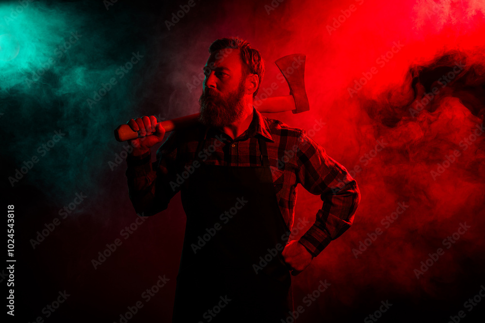 Photo of scary cruel halloween male character hold sharp ax isolated on dark misty mysterious background Photo of scary cruel halloween male character hold sharp ax isolated on dark misty mysterious background