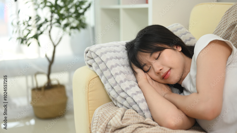 Young beautiful asian woman sleeping on couch at home Young beautiful asian woman sleeping on couch at home