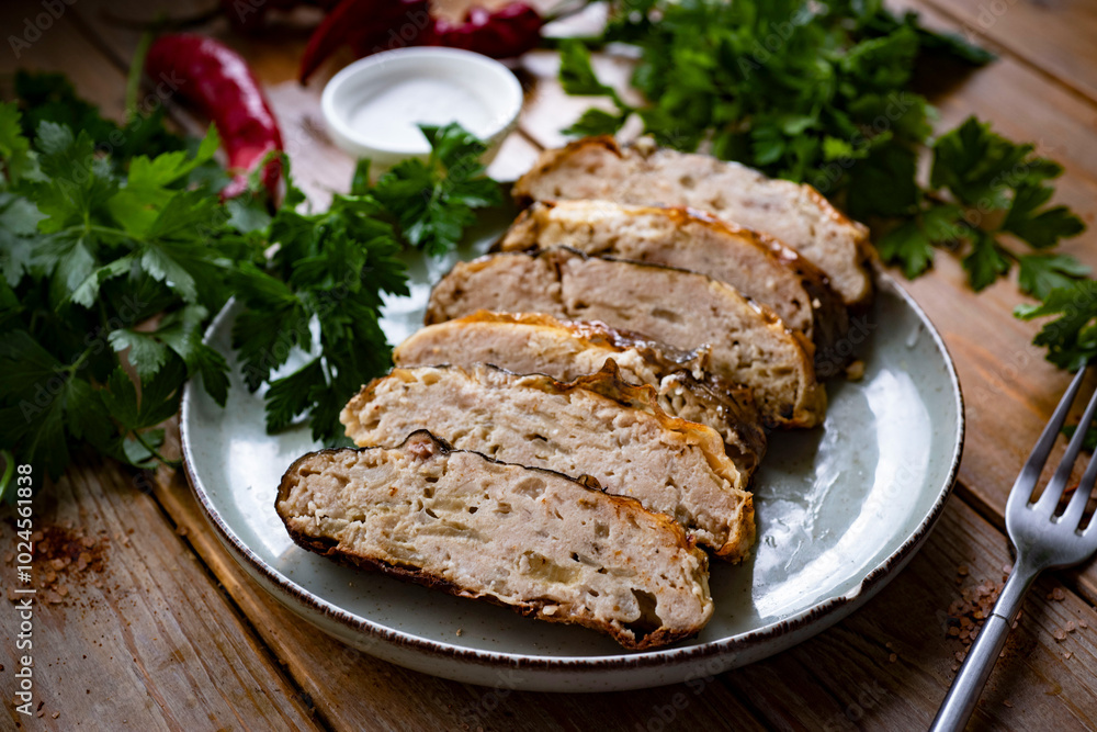 Gefilte fish on a plate on a wooden table. Stuffed fish for lunch. Stuffed carp on a plate on a wooden background. Close-up Gefilte fish on a plate on a wooden table. Stuffed fish for lunch. Stuffed carp on a plate on a wooden background. Close-up