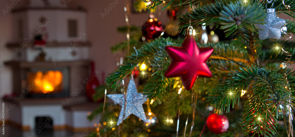 Christmas and New Years background with fir tree and blur burning fireplace . Christmas and New Years background with fir tree and blur burning fireplace .