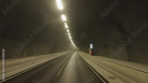 Car point of view driving in tunnel