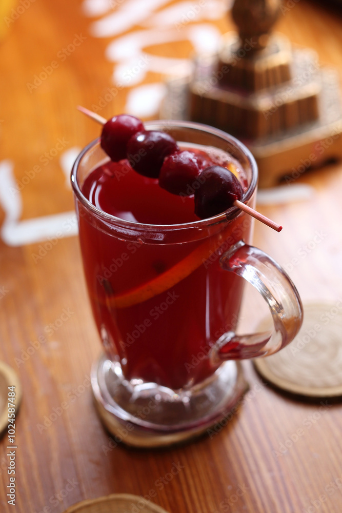 Cherry seasonal tea. A red winter aromatic warming drink. Seasonal hot spiced drink from infused tea. Cherry seasonal tea. A red winter aromatic warming drink. Seasonal hot spiced drink from infused tea.