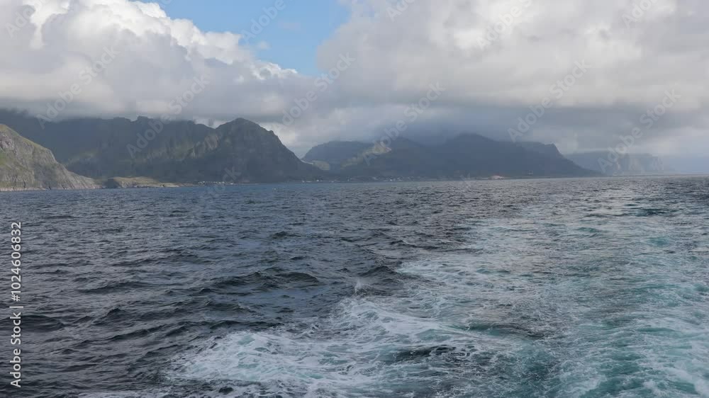 Family with kids and dog, traveling with ferry from Moskenesoya to Varoya with pet dog, dog in backpack Family with kids and dog, traveling with ferry from Moskenesoya to Varoya with pet dog, dog in backpack