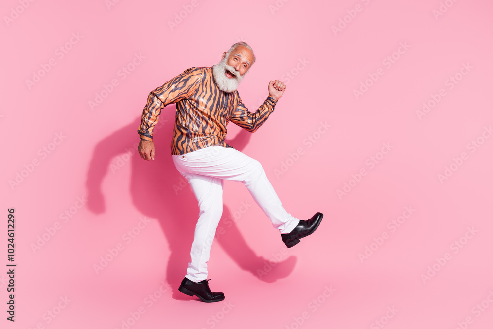 Fototapeta premium Photo of excited old man walking wear shiny shirt pants isolated pastel color background
