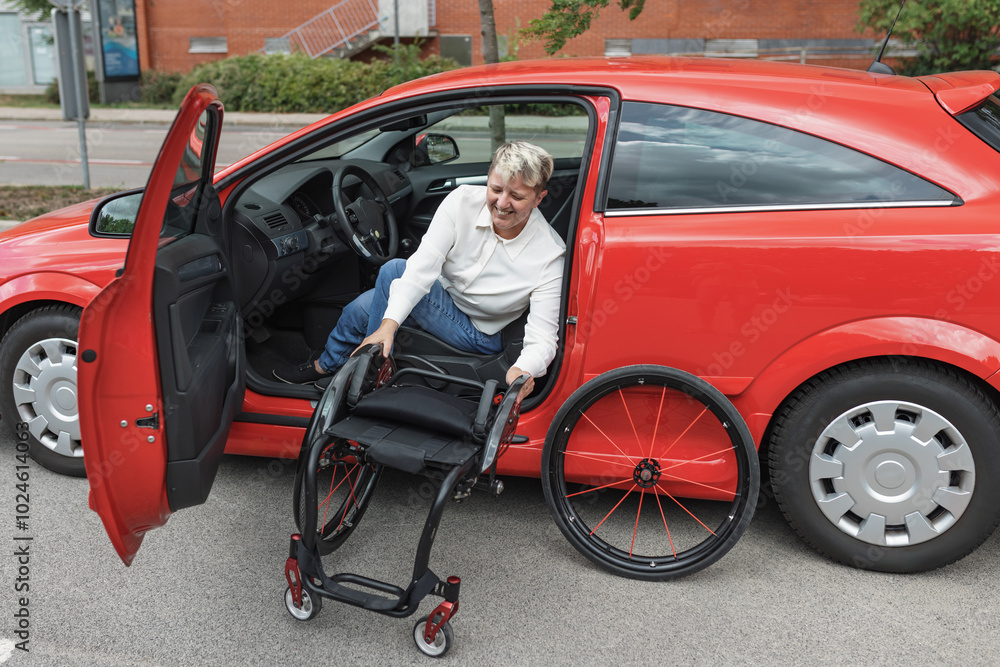 Woman with disability taking out her wheelchair from the car while sitting on the drivers seat. Accessible and adaptive equipment concept. Woman with disability taking out her wheelchair from the car while sitting on the drivers seat. Accessible and adaptive equipment concept.