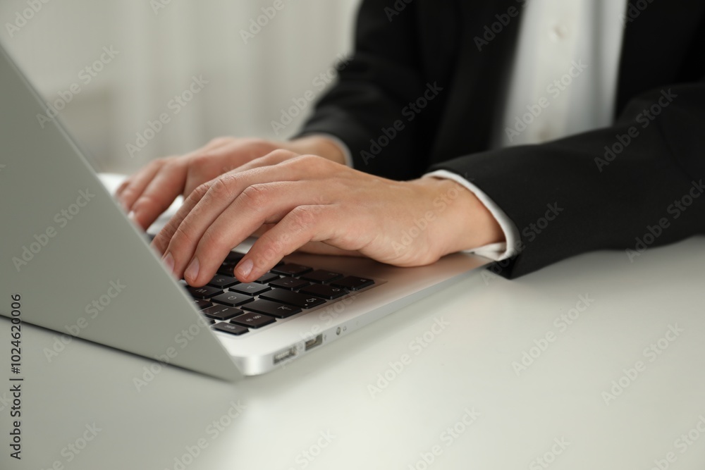 Businesswoman using laptop at white table indoors, closeup. Modern technology Businesswoman using laptop at white table indoors, closeup. Modern technology