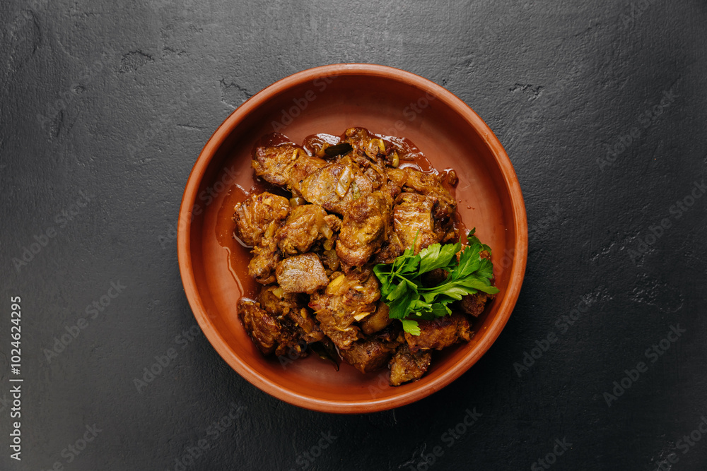 Top view of homemade roasted meat with onions, herbs. Perfect for food blogs, cookbooks, and menus Top view of homemade roasted meat with onions, herbs. Perfect for food blogs, cookbooks, and menus