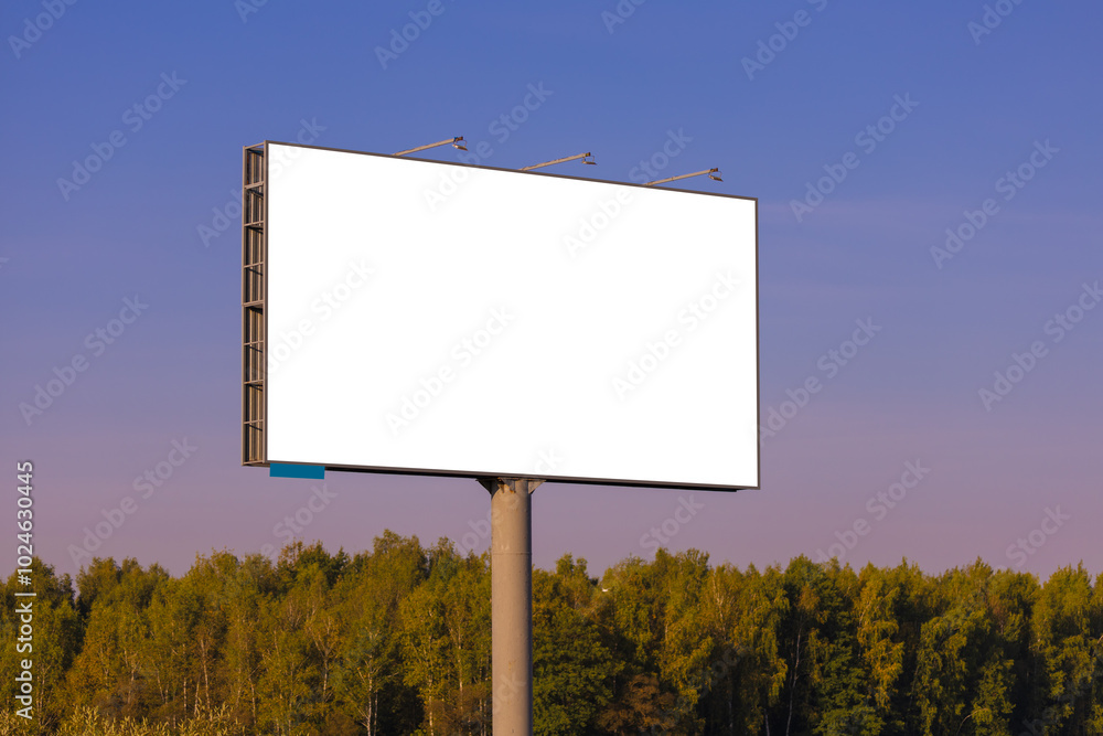 White billboard along the highway. Background for design and advertising. White billboard along the highway. Background for design and advertising.