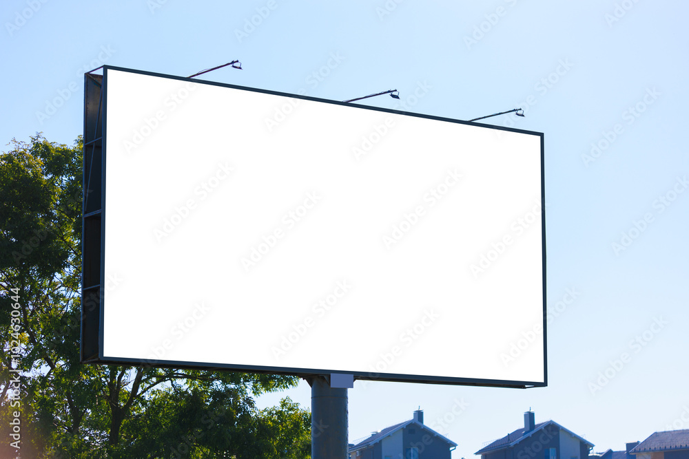 White billboard along the highway. Background for design and advertising. White billboard along the highway. Background for design and advertising.