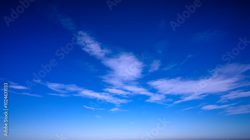 Blue sky with scattered clouds creating a serene atmosphere