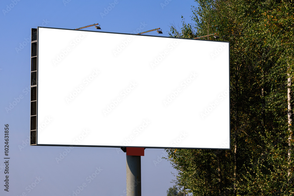 Background for design. Advertising billboard along the road in the city on a sunny day Background for design. Advertising billboard along the road in the city on a sunny day