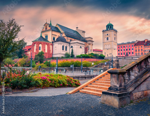 Colorful morning view of St. Anne's Academic Church and Observation Terrace on the Bell Tower. Amaezing autumn cityscape of capital of Poland - Warsaw city, Europe. Traveling concept background.