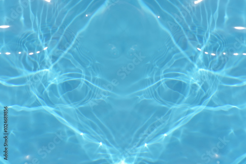 Blue water with ripples on the surface. Defocus blurred transparent blue colored clear calm water surface texture with splashes and bubbles. Water waves with shining pattern texture background.