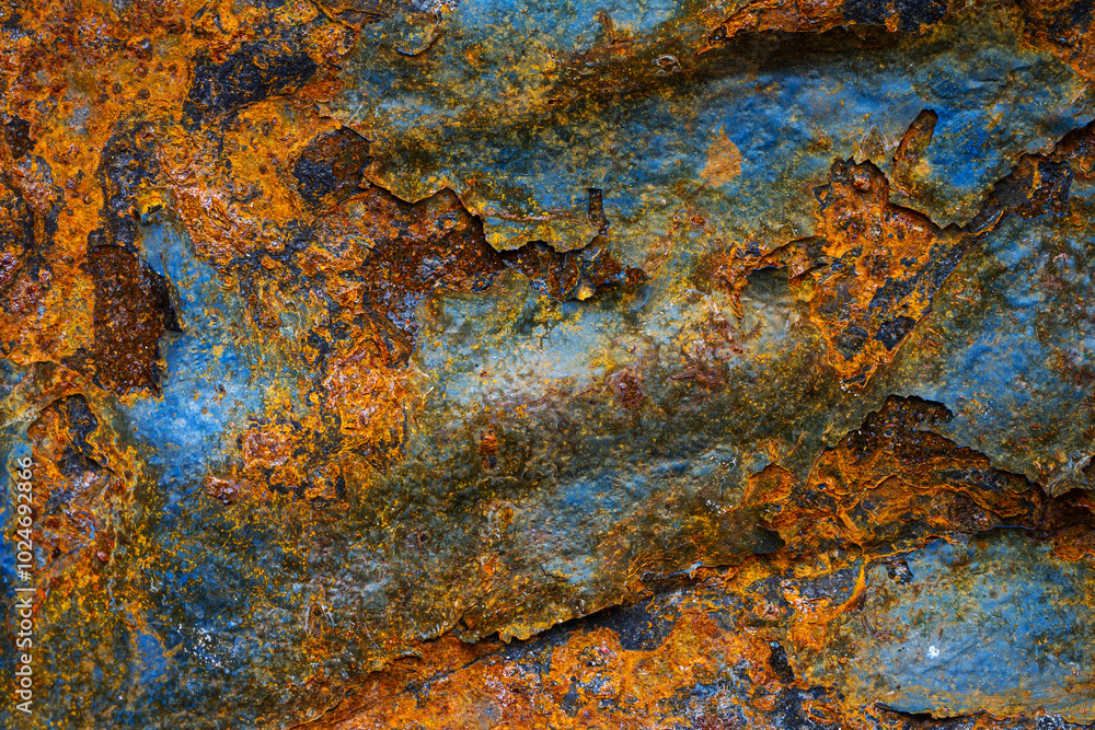 Rusty metal surface with shabby background paint. Blue cracked paint texture on an iron sheet. Fragment of an old metal door, Metal corrosion. Rusty metal surface with shabby background paint. Blue cracked paint texture on an iron sheet. Fragment of an old metal door, Metal corrosion.