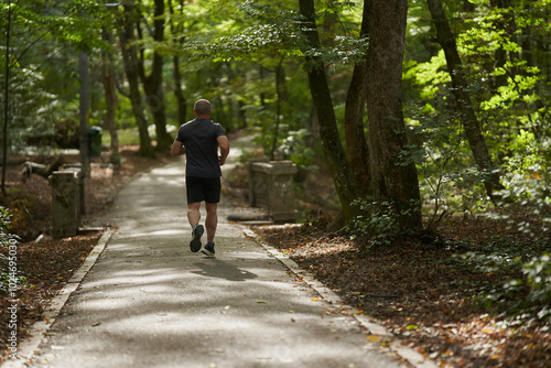 Wallpaper Mural Athletic man running in park Torontodigital.ca