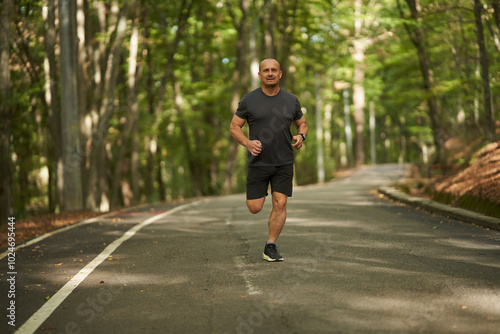 Athletic man running in park