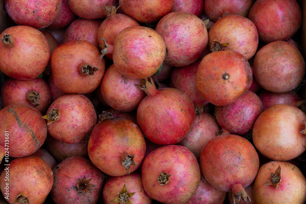 A background of fresh pomegranates in perfect details. A background of fresh pomegranates in perfect details.