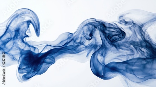 Blue smoke forming abstract, fluid shapes as it explodes mid-air, captured on a white background.