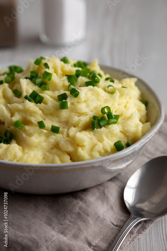 Homemade Chive and Garlic Mashed Potatoes in a Bowl, side view. Close-up.