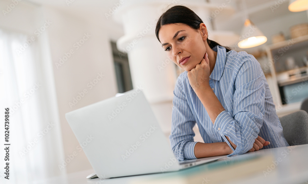 Young beautiful woman using computer to check social media, working or read emails. Young beautiful woman using computer to check social media, working or read emails.