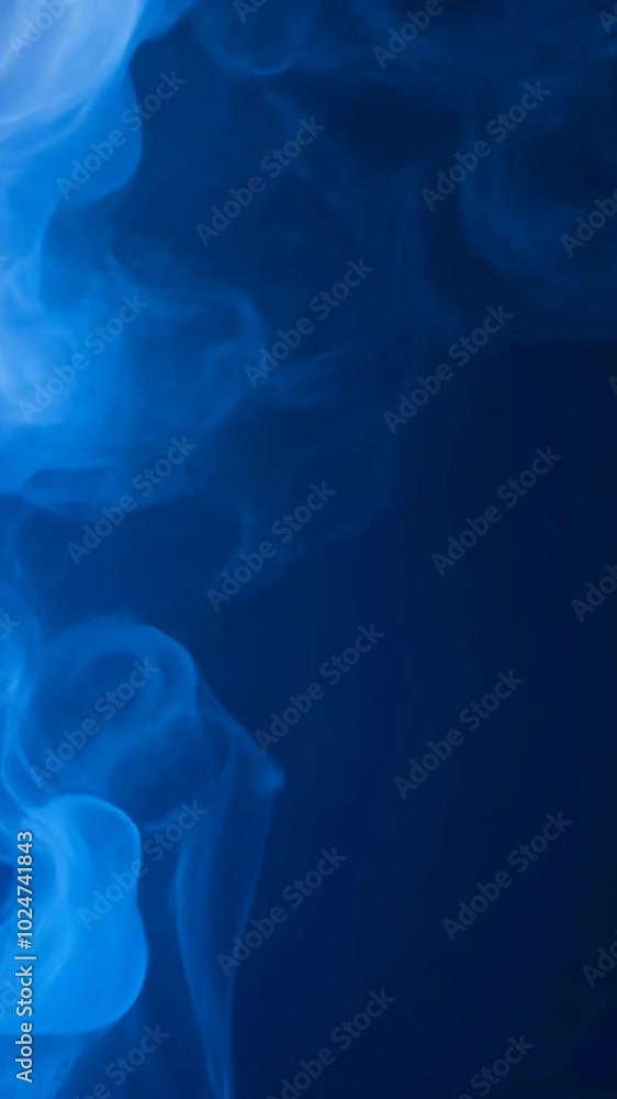 Blue smoke on a dark background, abstract texture. Mysterious atmosphere and artistic concept Blue smoke on a dark background, abstract texture. Mysterious atmosphere and artistic concept