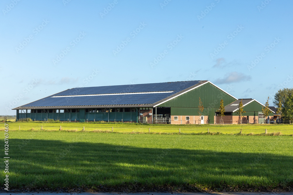 A Dutch farm with solar panels on the roof A Dutch farm with solar panels on the roof