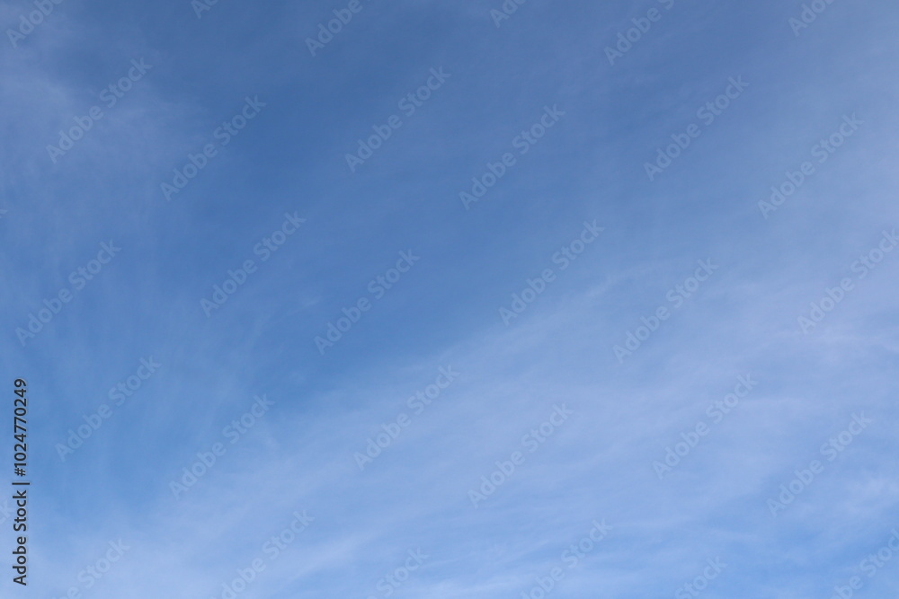 blue sky in late summer with light cirrus or cirrocumulus clouds as background blue sky in late summer with light cirrus or cirrocumulus clouds as background