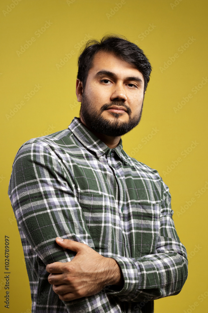 serious man holding his elbow serious man holding his elbow